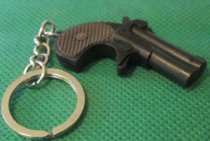 Mini black plastic GUN keyring key chain 2"