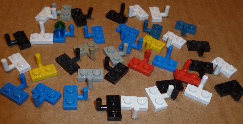 LEGO Parts lot of 38 Plates 1 x 2 with arm, mixed colors - Click Image to Close